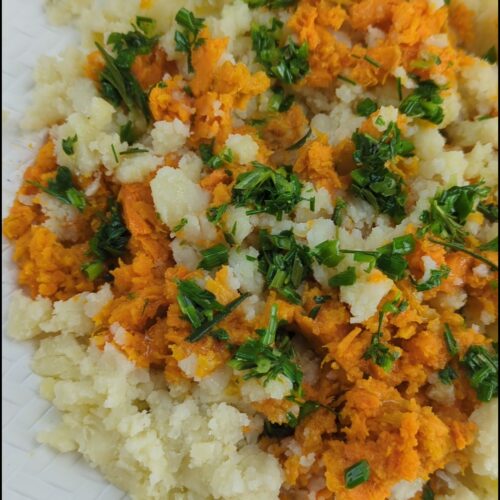 “Alternating dollops of Yukon gold and sweet potato mash in a ceramic bowl.
