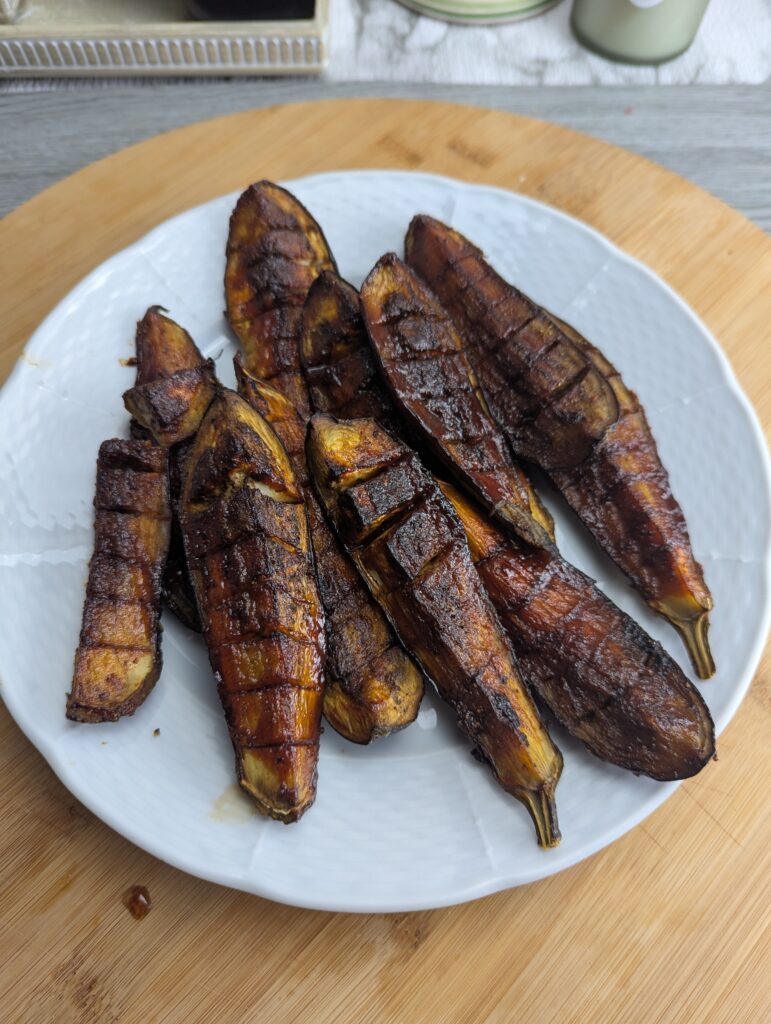Smoky, sticky Charred Eggplant Ribs glazed with tangy pomegranate BBQ sauce. A modern vegetarian BBQ recipe that’s easy, glossy, and full of Mediterranean flavor.