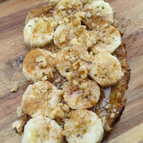 Slice of sourdough toast topped with homemade walnut butter and bananas