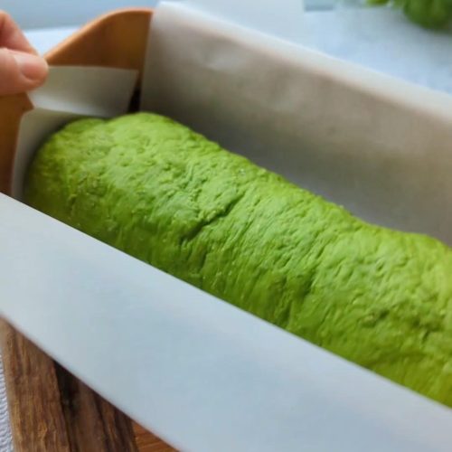 a bright green bread loaf made with spinach